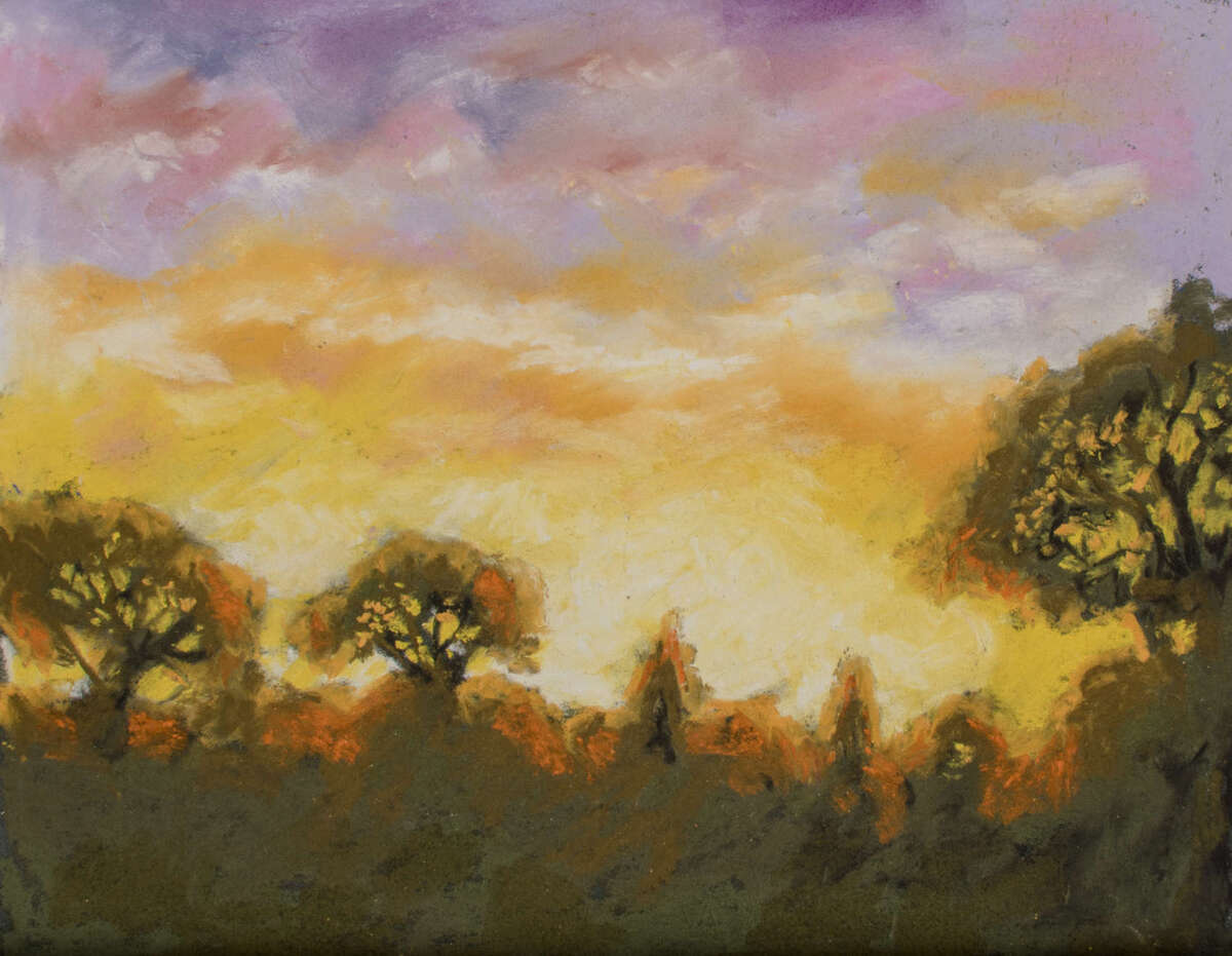 Sunset over tree lined Parkstone Avenue